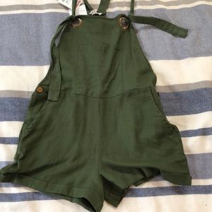 Green overalls, loose fit